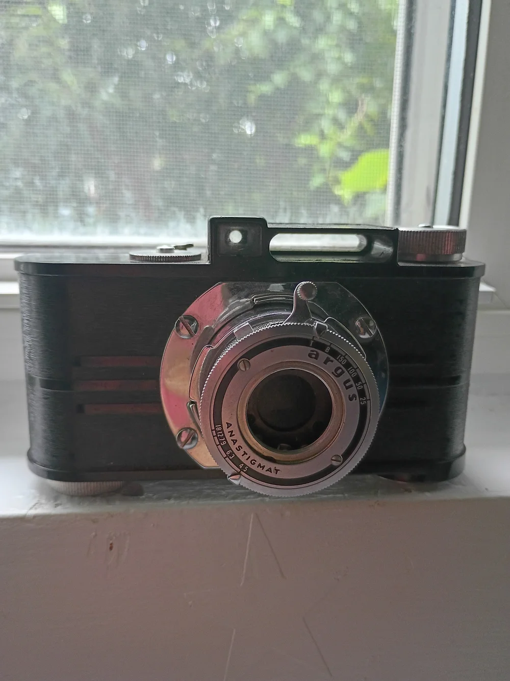 Vintage-Style Black Camera with Chrome Lens ARGUS